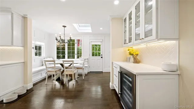a view of living room with furniture and wooden floor