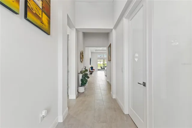 a bathroom with double vanity sinks a large mirror and a window