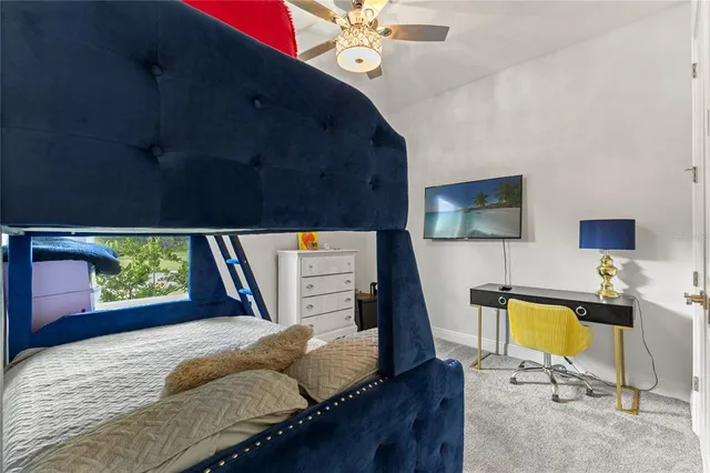 a view of a dining room with furniture wooden floor and a floor to ceiling window
