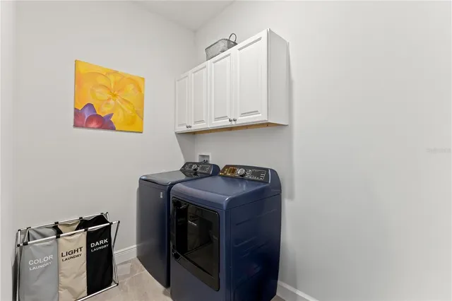 a dining room with furniture and a window