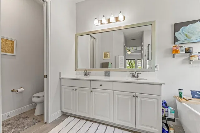 an aerial view of residential houses with outdoor space and swimming pool