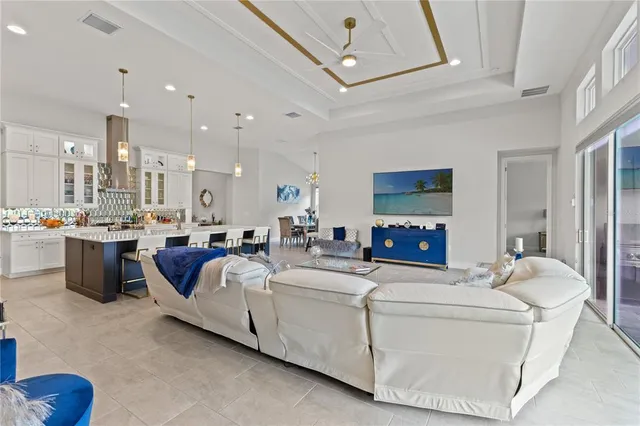 a living room with lots of furniture and a table