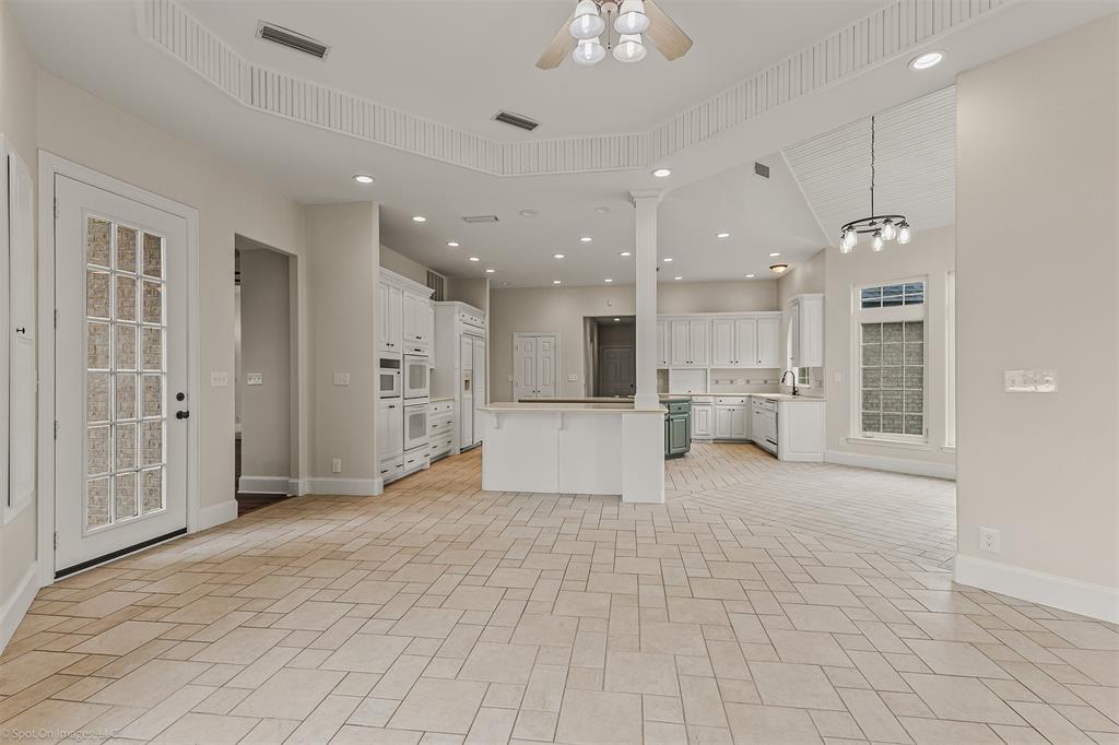 15183 Valley View Forney, TX 75126 - Photo 11 of 38 a view of a kitchen with kitchen island and stainless steel appliances
