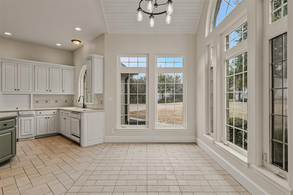 15183 Valley View Forney, TX 75126 - Photo 12 of 38 a large white kitchen with cabinets
