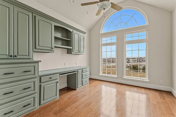a view of kitchen with stainless steel appliances granite countertop a stove and a microwave