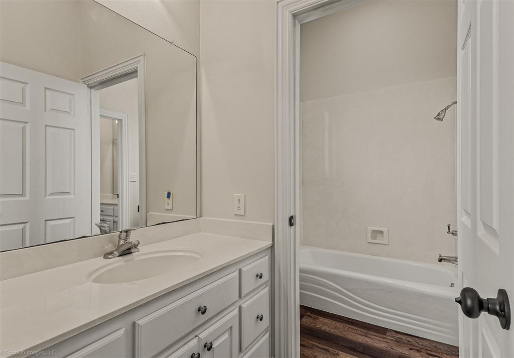 15183 Valley View Forney, TX 75126 - Photo 23 of 38 a bathroom with a sink and a bathtub