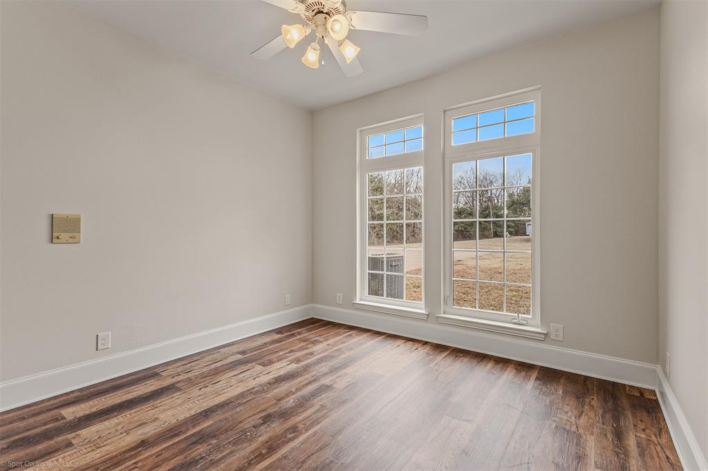 15183 Valley View Forney, TX 75126 - Photo 28 of 38 a view of an empty room with wooden floor and a window