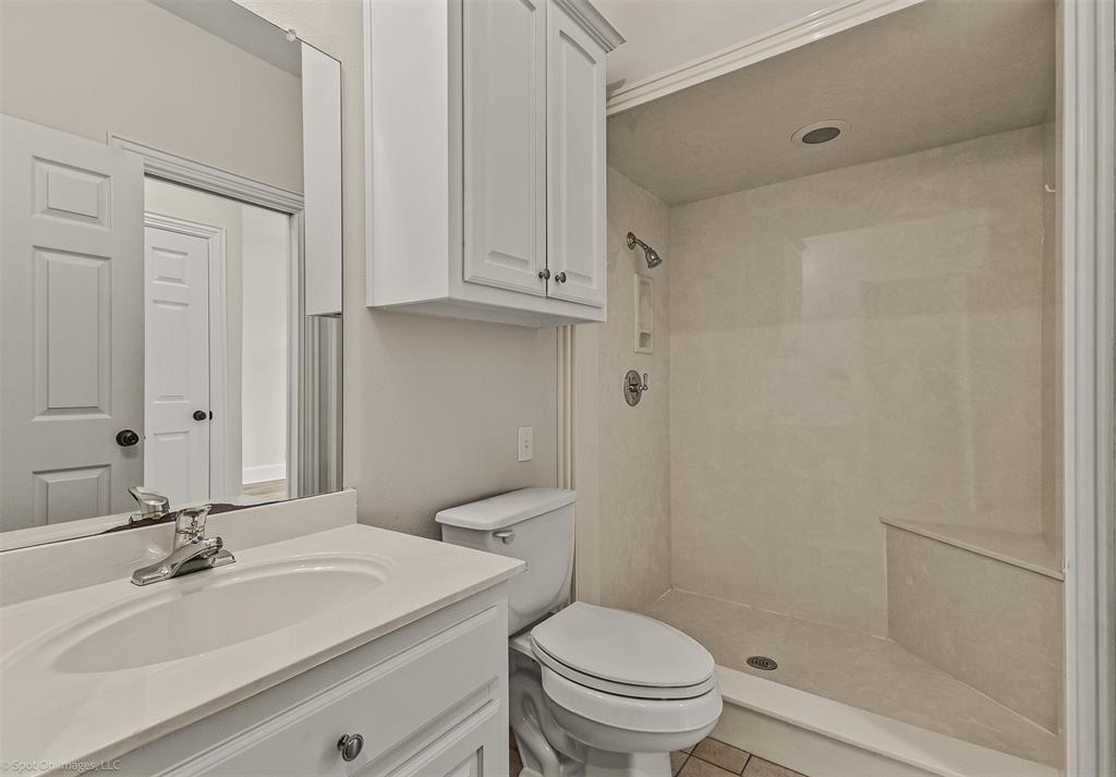 15183 Valley View Forney, TX 75126 - Photo 30 of 38 a bathroom with a sink a toilet and vanity