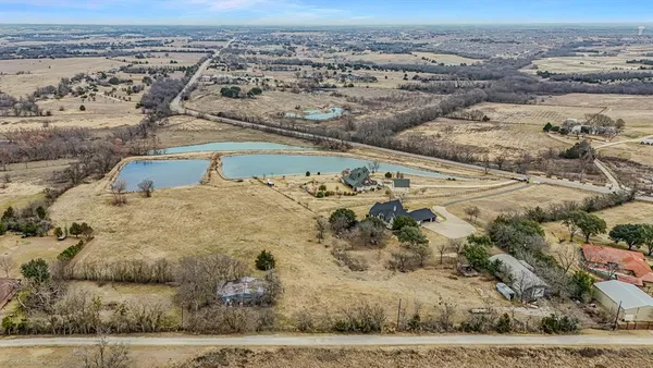 an aerial view of beach and residential space
