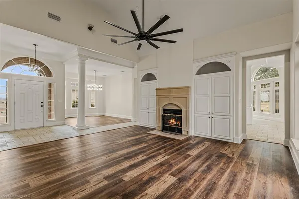 a view of livingroom with hardwood floor and a ceiling fan