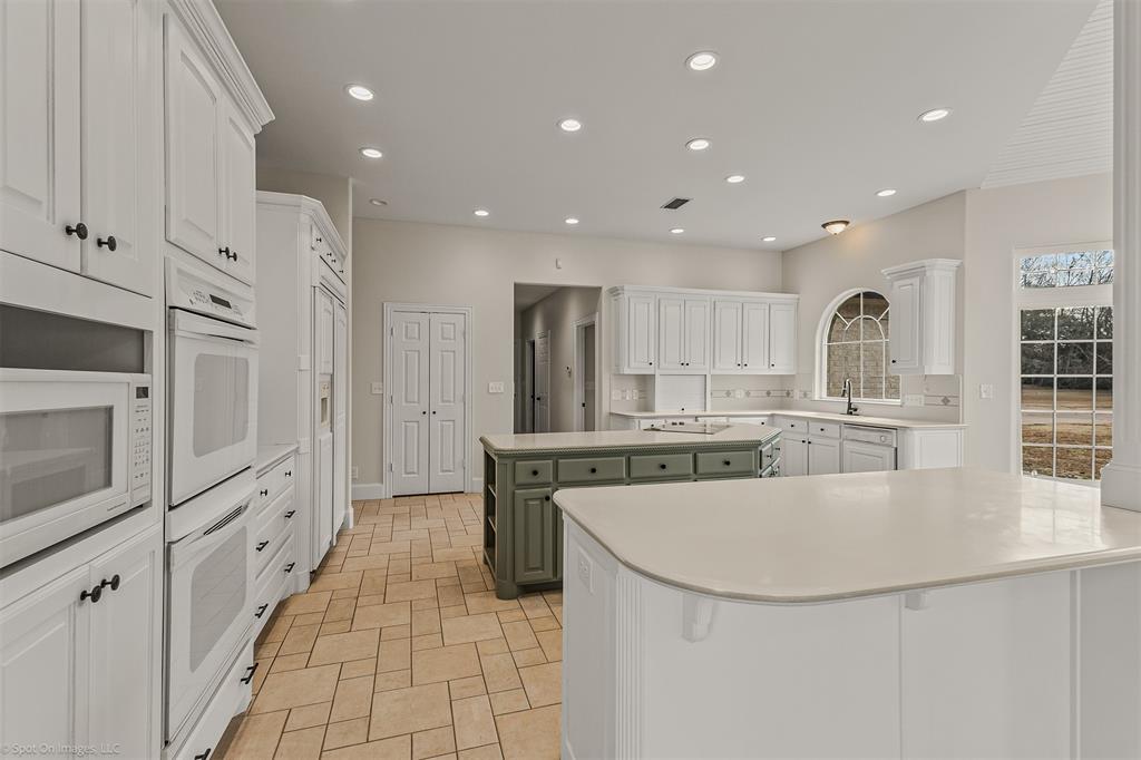 15183 Valley View Forney, TX 75126 - Photo 8 of 38 a large kitchen with stainless steel appliances granite countertop a large counter top and a stove with kitchen island