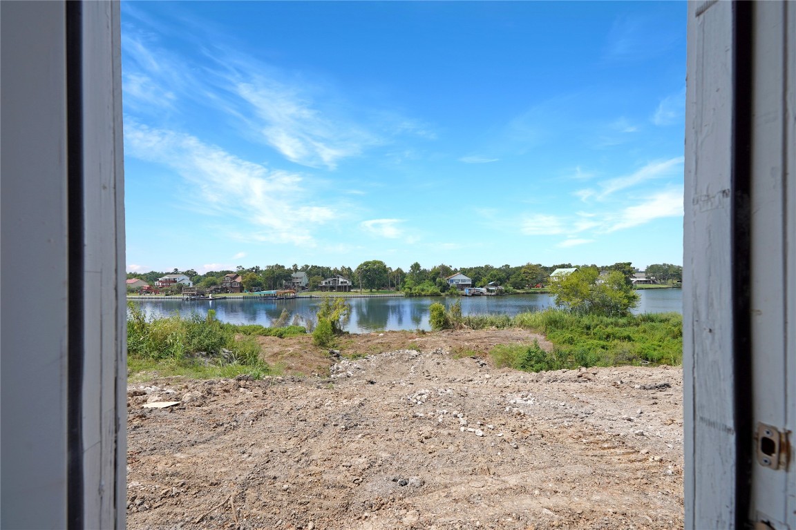 207 Riverside Street Highlands, TX 77562 - Photo 13 of 29 a view of a lake from a window