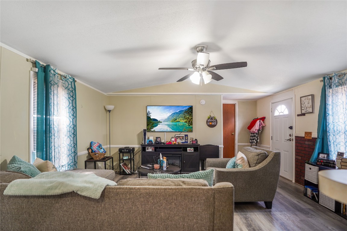 207 Riverside Street Highlands, TX 77562 - Photo 15 of 29 a living room with furniture and a flat screen tv