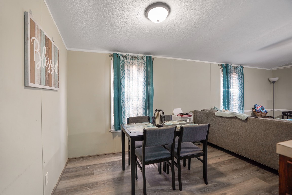 207 Riverside Street Highlands, TX 77562 - Photo 22 of 29 a view of a dining room with furniture and window