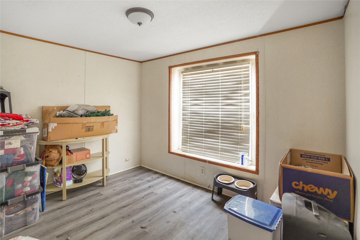 207 Riverside Street Highlands, TX 77562 - Photo 26 of 29 a view of a room with gym equipment and a window