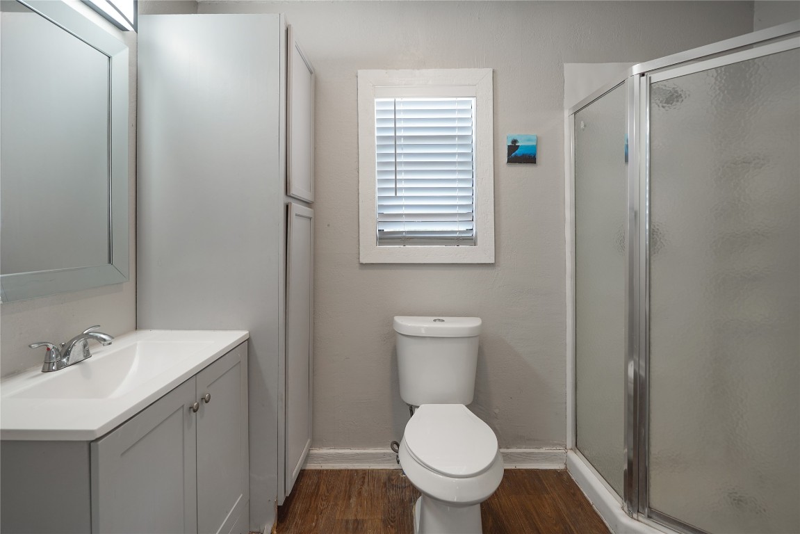 207 Riverside Street Highlands, TX 77562 - Photo 28 of 29 a bathroom with a sink toilet and vanity