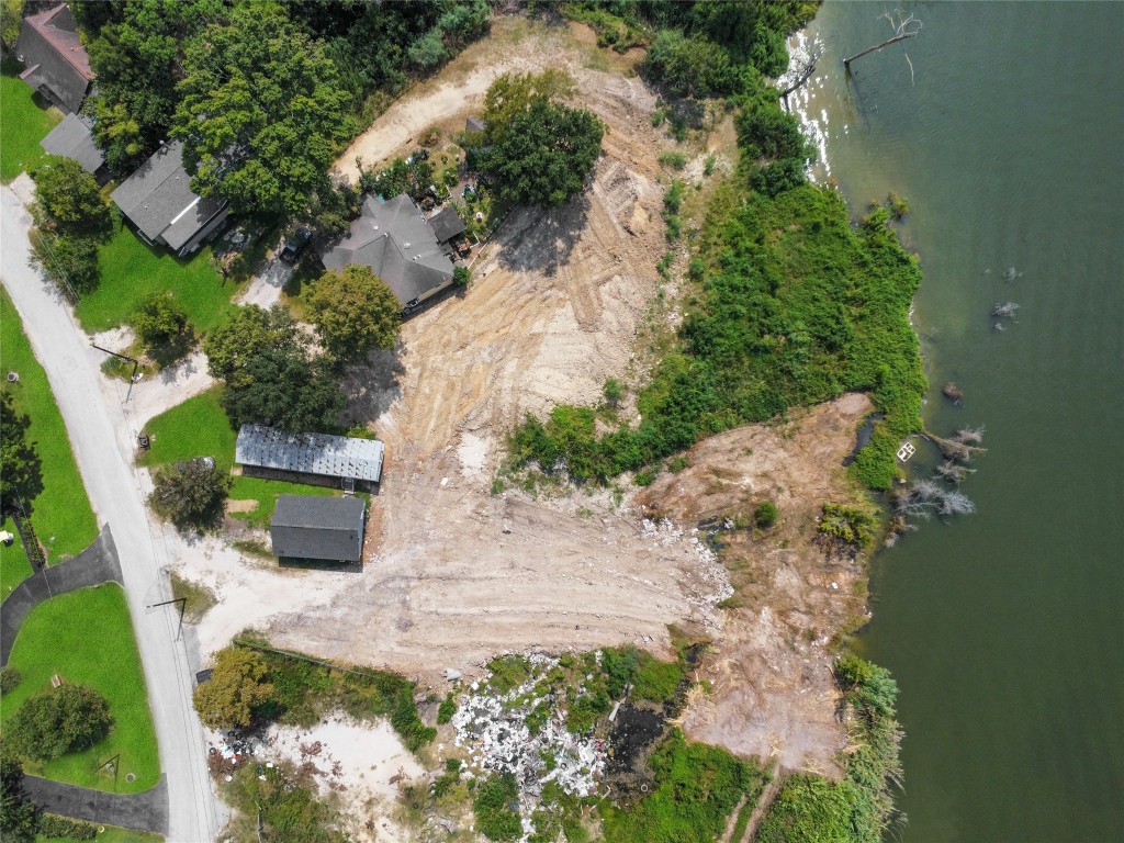 207 Riverside Street Highlands, TX 77562 - Photo 4 of 29 an aerial view of a house with a yard and lake view
