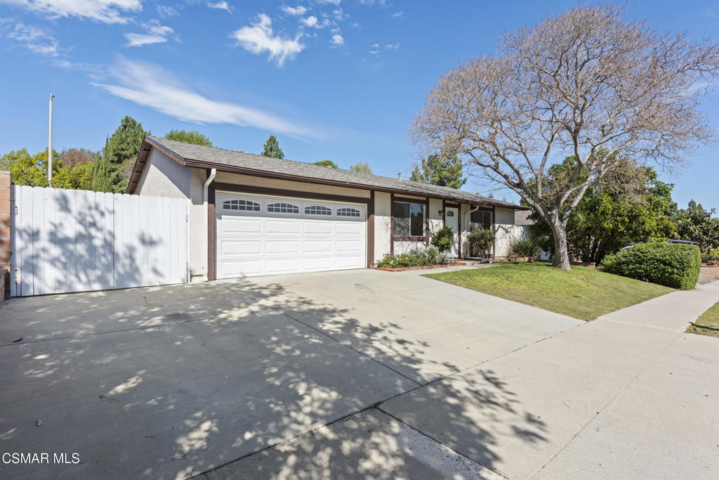 14773 Stanford Street Moorpark, CA 93021 - Photo 1 of 26 a front view of a house with a yard and garage