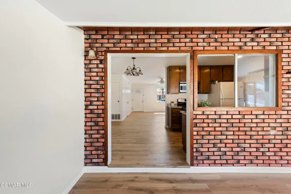 a view of a balcony with wooden floor