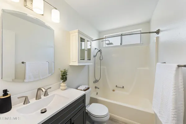 a view of a bathroom from a hallway