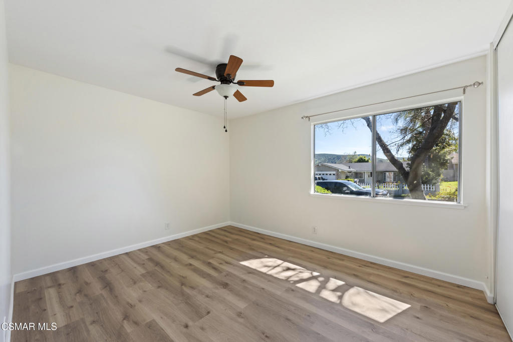 14773 Stanford Street Moorpark, CA 93021 - Photo 20 of 26 a view of empty room with wooden floor and fan