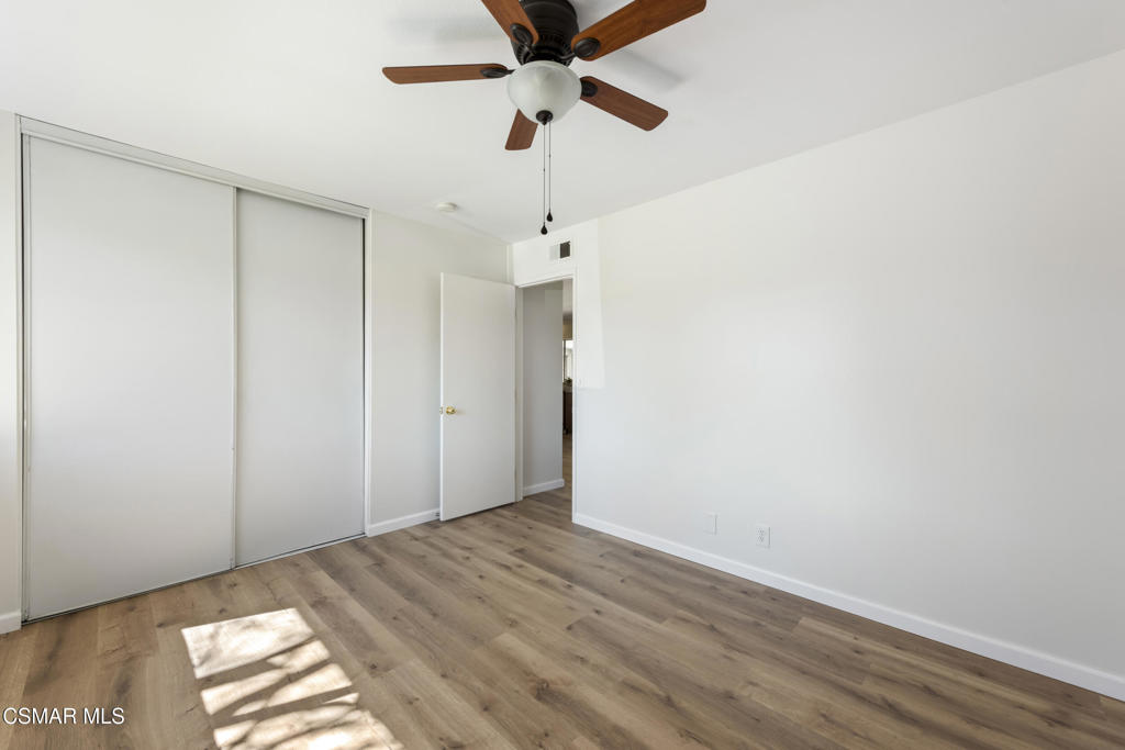 14773 Stanford Street Moorpark, CA 93021 - Photo 21 of 26 a view of a room with a ceiling fan and a window