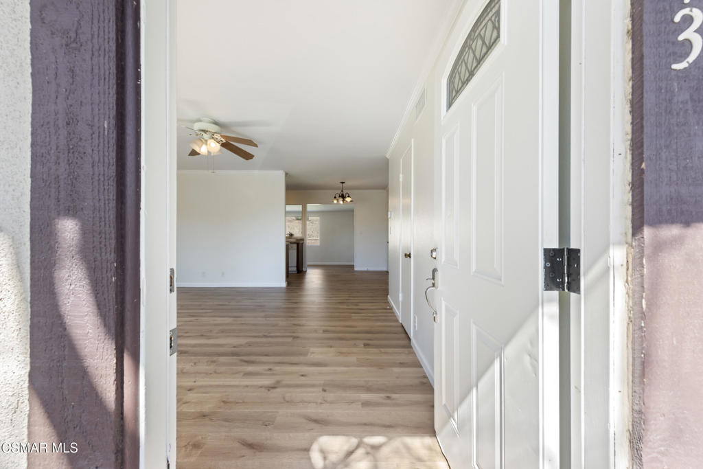 14773 Stanford Street Moorpark, CA 93021 - Photo 4 of 26 a view of a hallway with wooden floor and staircase