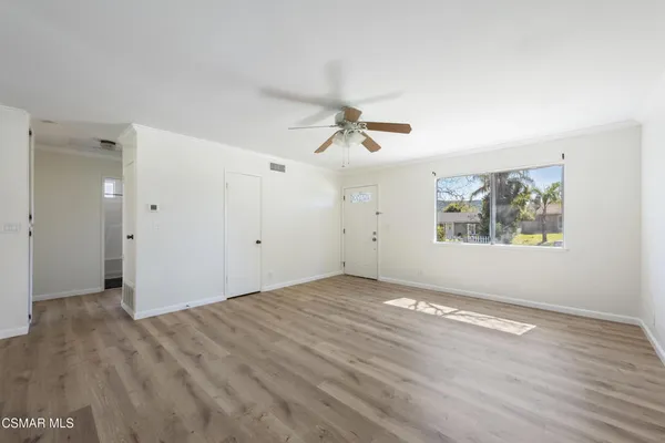 a view of an empty room with a window