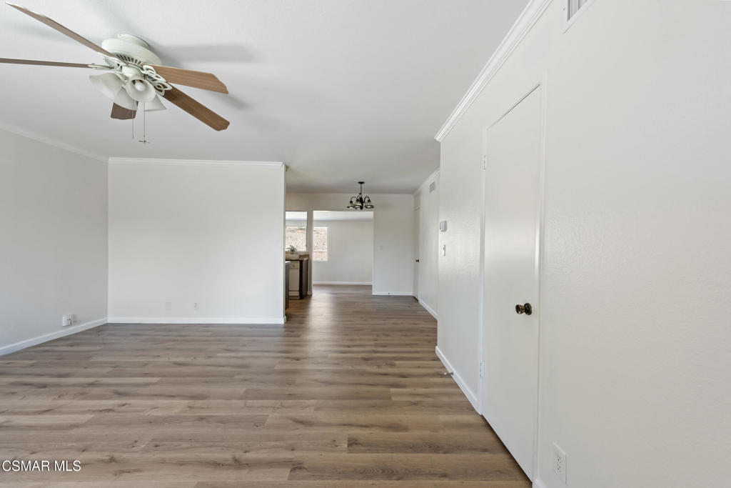 14773 Stanford Street Moorpark, CA 93021 - Photo 8 of 26 a view of a hallway with wooden floor
