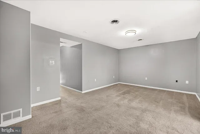 a city street lined with buildings and cars