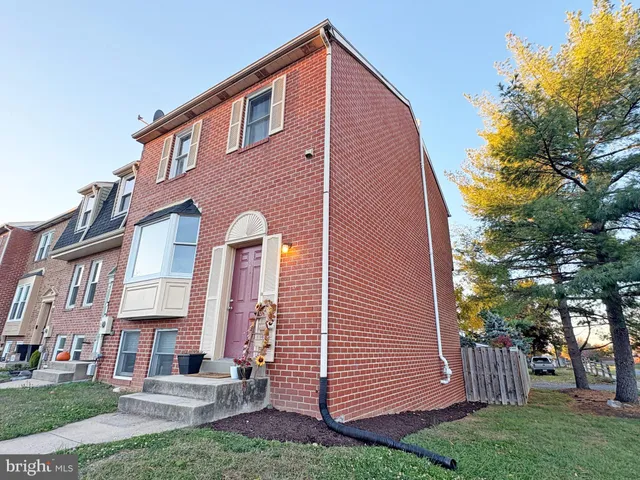 a view of a backyard with a tree