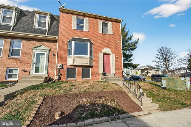 a picture of a bench in front of a wall