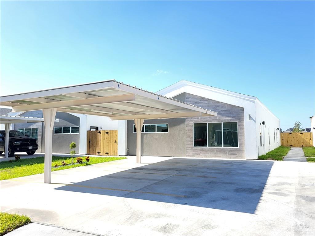 1416 East Hibiscus Avenue, Unit 3 McAllen, TX 78501 - Photo 2 of 11 a view of a house with swimming pool and yard