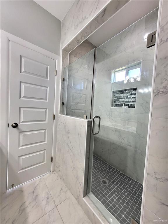 1416 East Hibiscus Avenue, Unit 3 McAllen, TX 78501 - Photo 9 of 11 a bathroom with a glass shower door