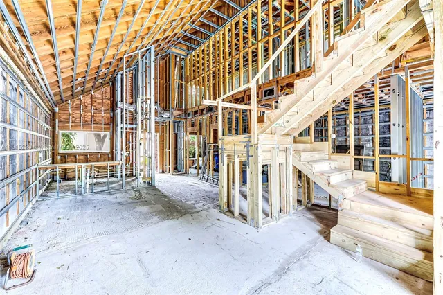 a view of a house with swimming pool and a yard