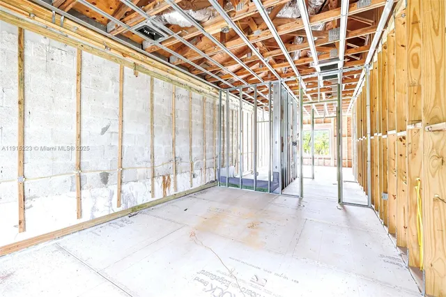 a view of a backyard with a garden and deck