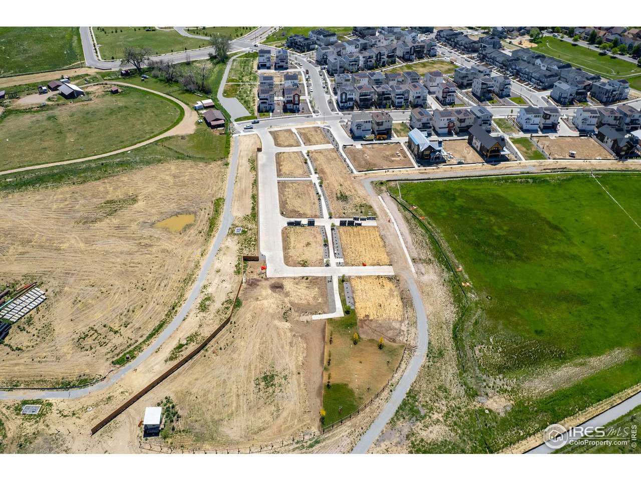 1642 Benjamin Lane Lafayette, CO 80026 - Photo 12 of 15 an aerial view of a residential apartment building with a yard
