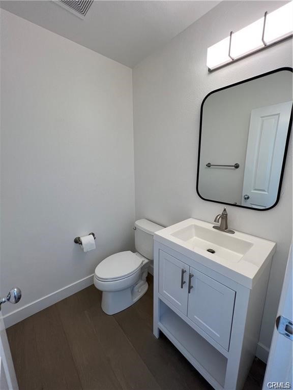53 Bellwind Irvine, CA 92603 - Photo 11 of 12 a bathroom with a toilet sink and mirror