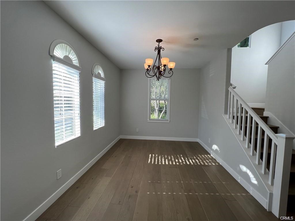 53 Bellwind Irvine, CA 92603 - Photo 4 of 12 wooden floor in an empty room with a window