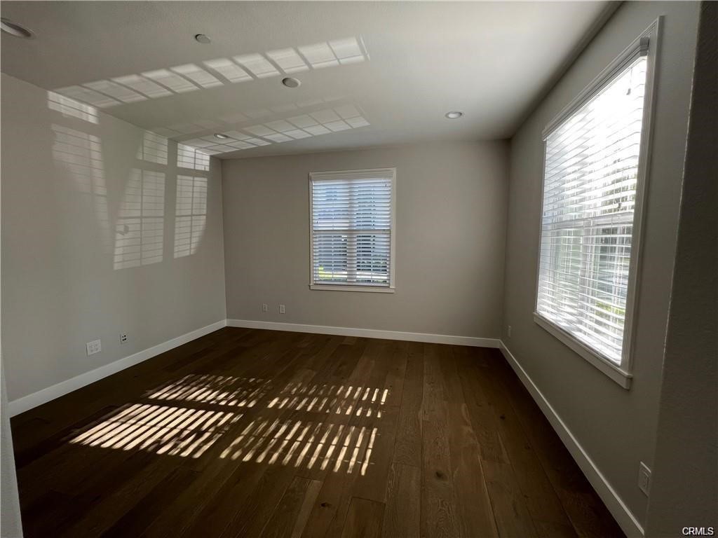 53 Bellwind Irvine, CA 92603 - Photo 7 of 12 a view of an empty room window and wooden floor