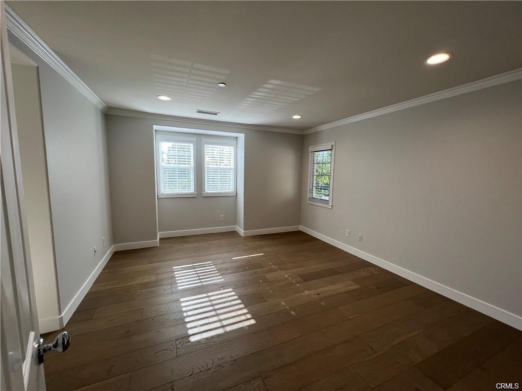 53 Bellwind Irvine, CA 92603 - Photo 8 of 12 an empty room with windows