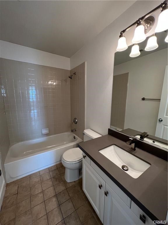 53 Bellwind Irvine, CA 92603 - Photo 10 of 12 a bathroom with a sink a toilet a mirror a bathtub and shower