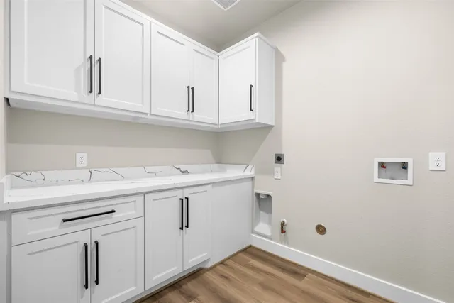 a view of cabinets with wooden floor