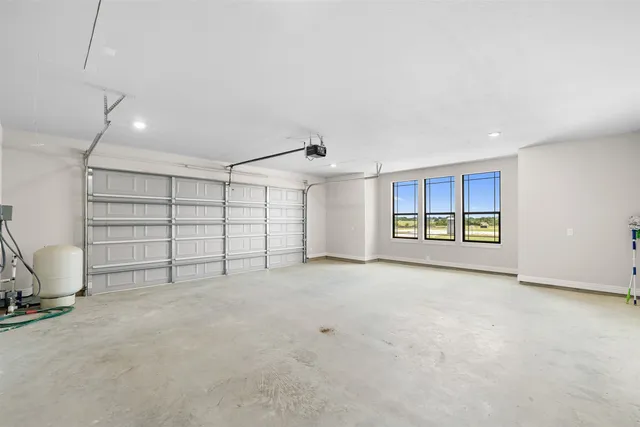 an empty room with furniture and white walls