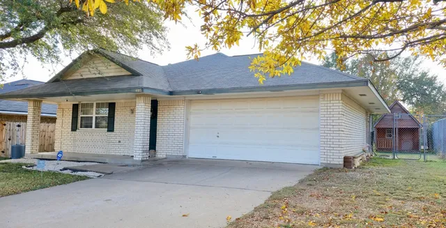 a small white house with a outdoor space