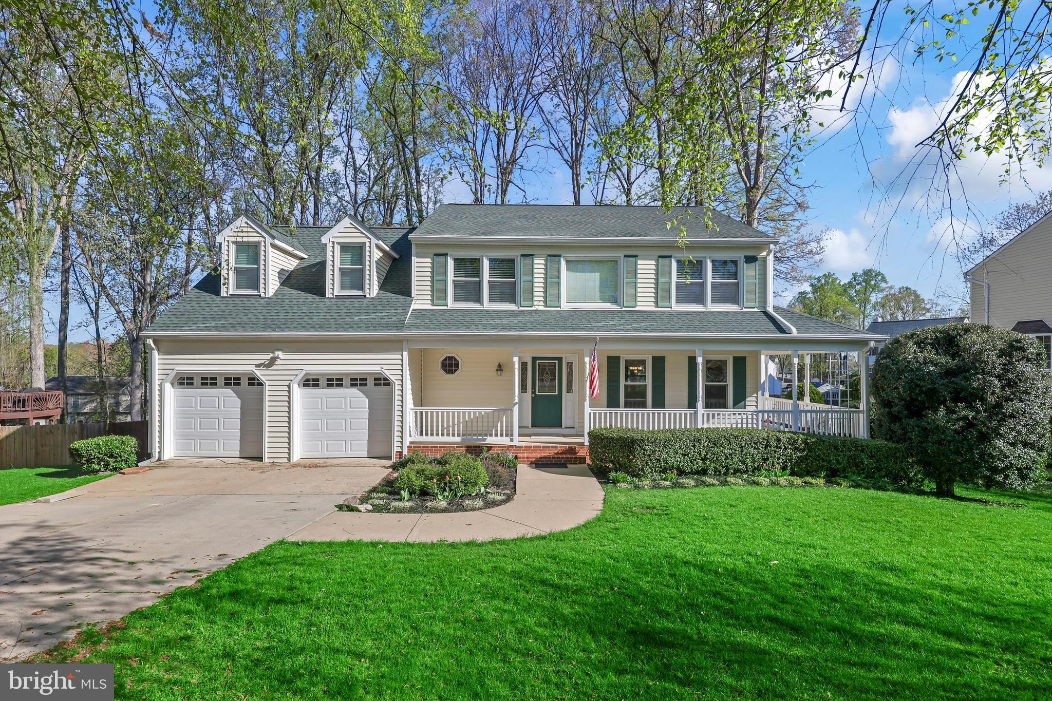 233 Choptank Road Stafford, VA 22556 - Photo 1 of 65 a front view of a house with a yard and trees