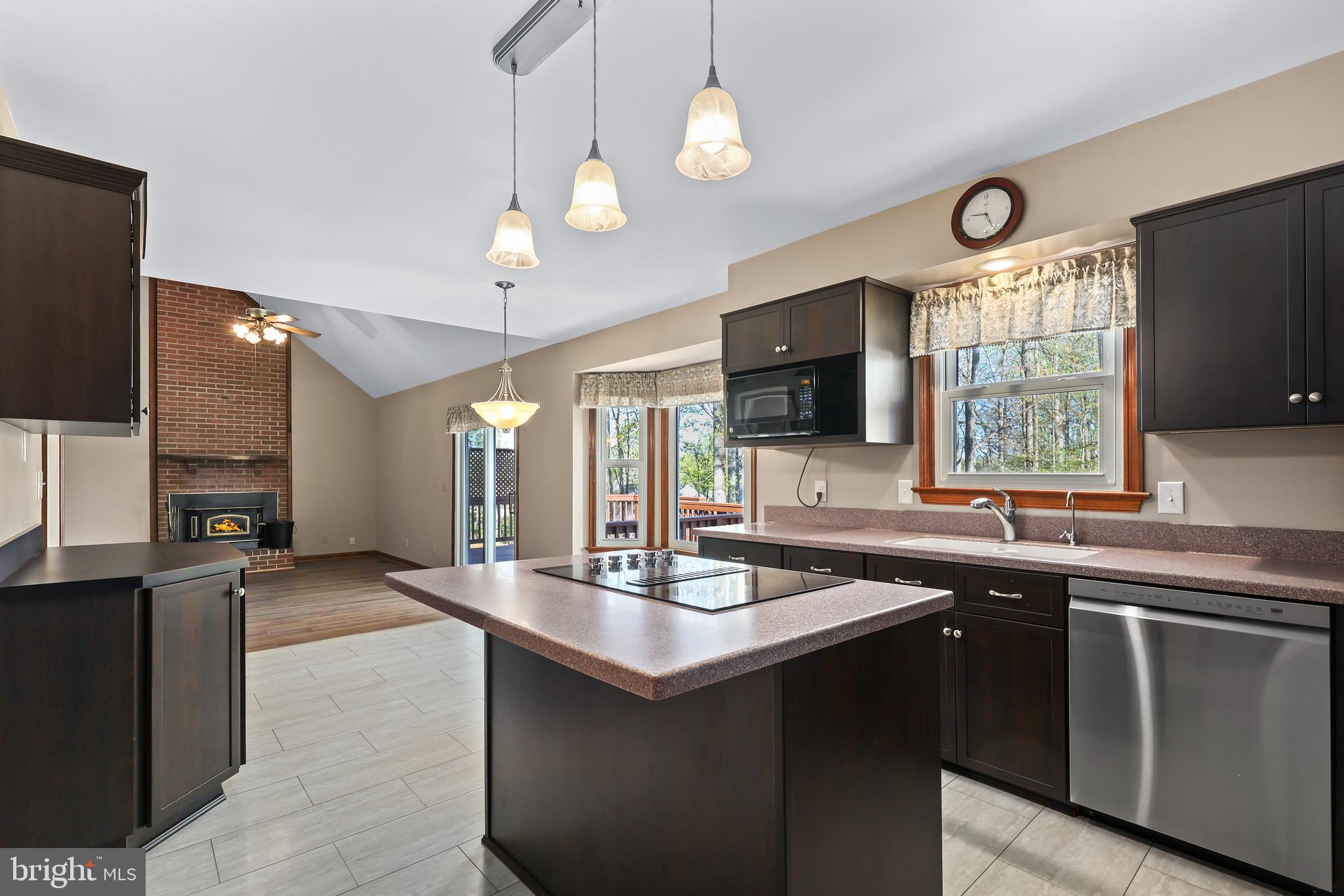 233 Choptank Road Stafford, VA 22556 - Photo 11 of 65 a kitchen with lots of counter space a sink and a window