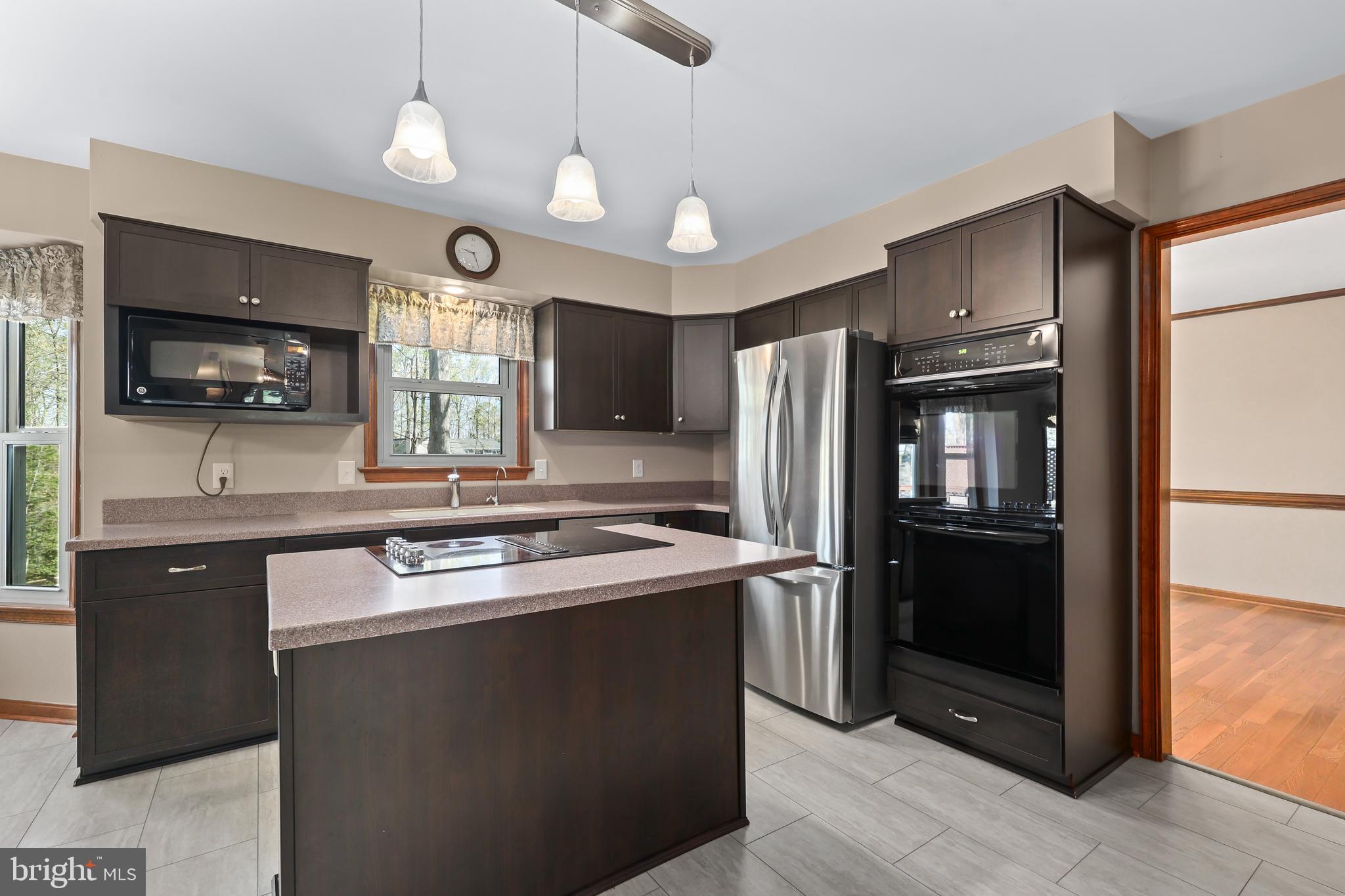 233 Choptank Road Stafford, VA 22556 - Photo 12 of 65 a kitchen with stainless steel appliances granite countertop a refrigerator a stove a sink and a microwave