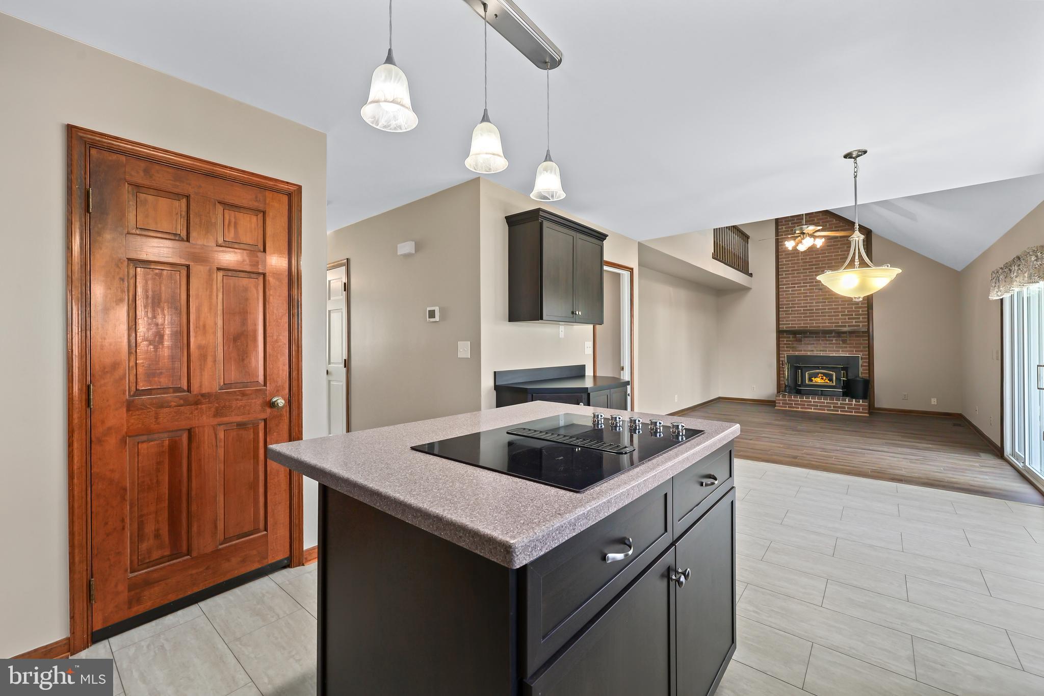 233 Choptank Road Stafford, VA 22556 - Photo 13 of 65 a kitchen with stainless steel appliances granite countertop a sink and a refrigerator