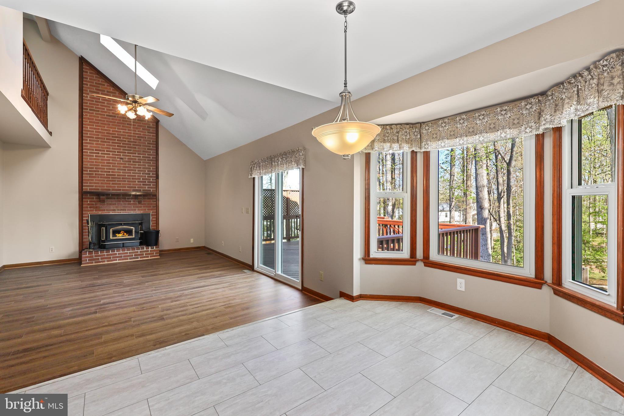 233 Choptank Road Stafford, VA 22556 - Photo 17 of 65 a view of an empty room with glass door and windows